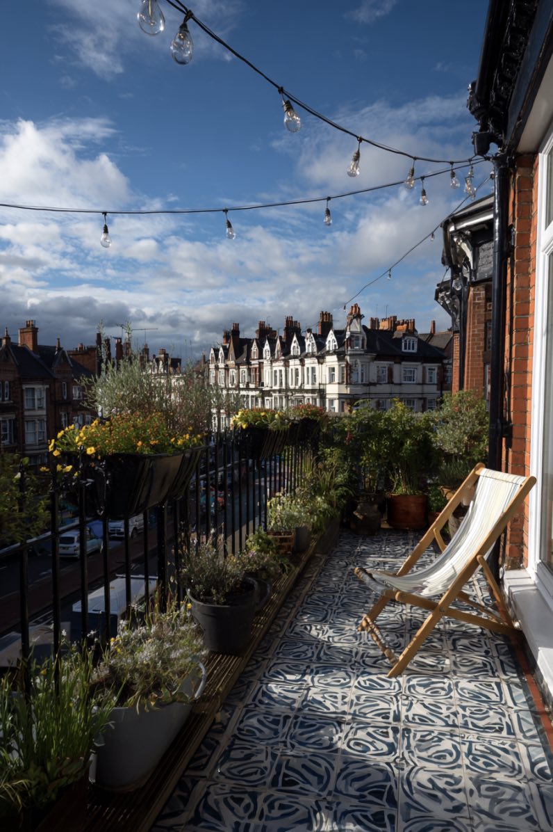 Charming Balcony with a Rooftop Garden View