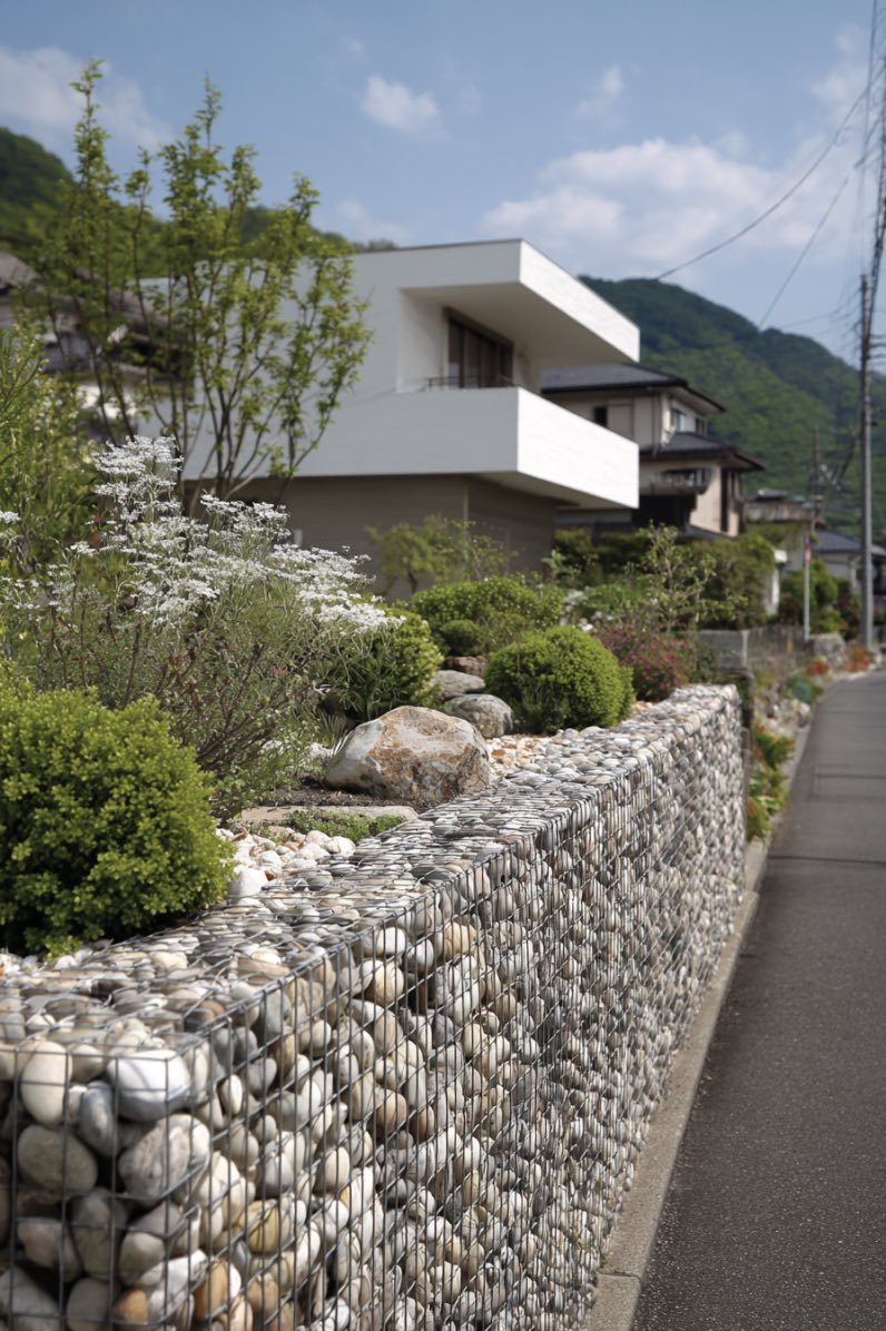 Modern Stone and Wire Mesh Garden Fence