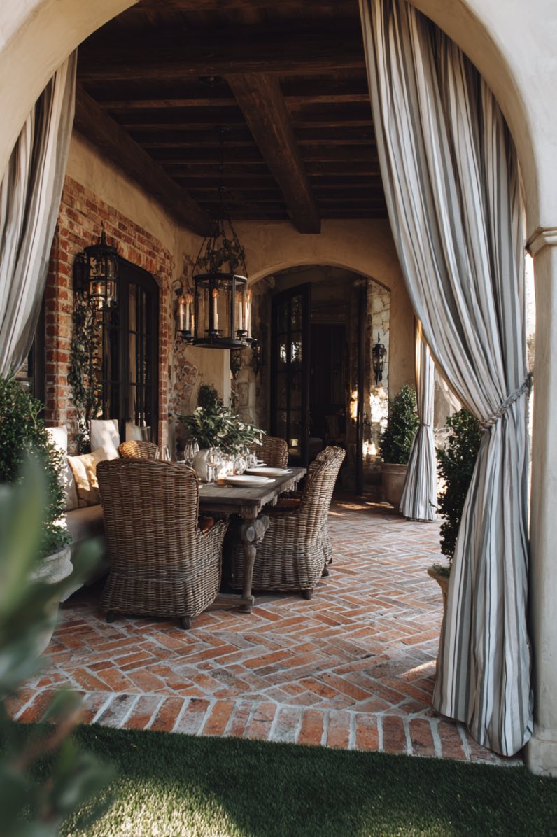 Charming Brick Patio with Archway Curtains